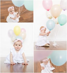 One year old baby girl playing with balloons by Raindancer Studios Indianapolis Children Photographer Jill Howell