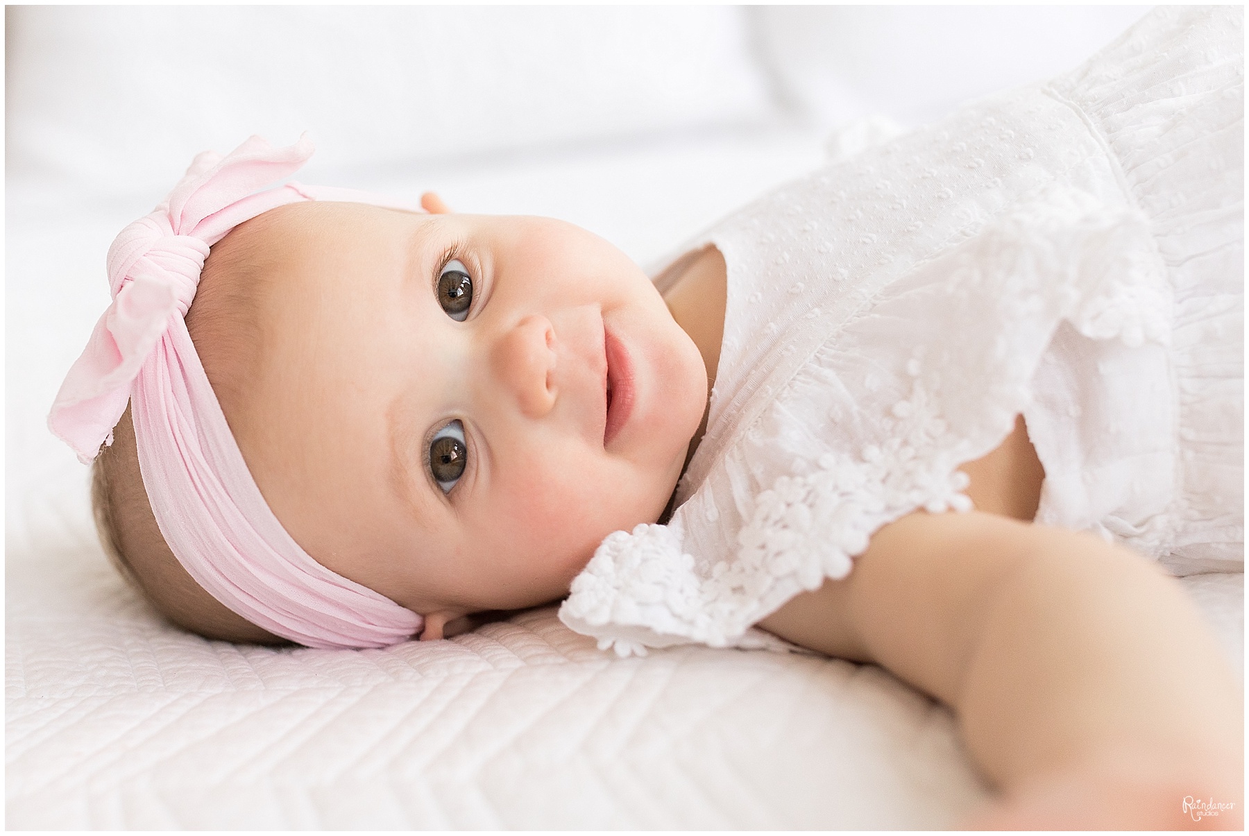One year old baby girl in pink bow by Raindancer Studios Indianapolis Children Photographer Jill Howell