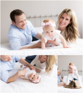 Parents and one year old daughter playing on bed by Raindancer Studios Indianapolis Children Photographer Jill Howell