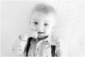 One year old boy with his finger in his mouth by Raindancer Studios Indianapolis Family Photographer Jill Howelll