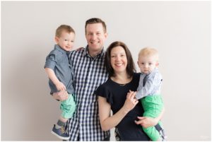 Parents holding two sons and smiling by Raindancer Studios Indianapolis Family Photographer Jill Howelll