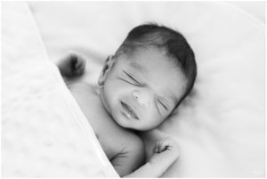 Newborn baby boy sleeping under a blanket by Raindancer Studios Indianapolis Newborn Photographer Jill Howelll