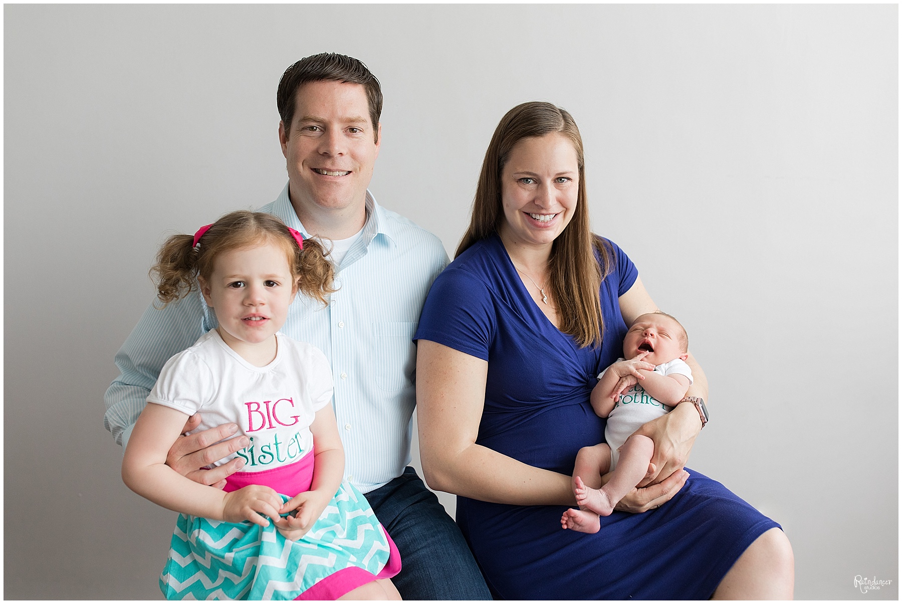 Parents holding their daughter and newborn son by Raindancer Studios Indianapolis Newborn Photographer Jill Howell