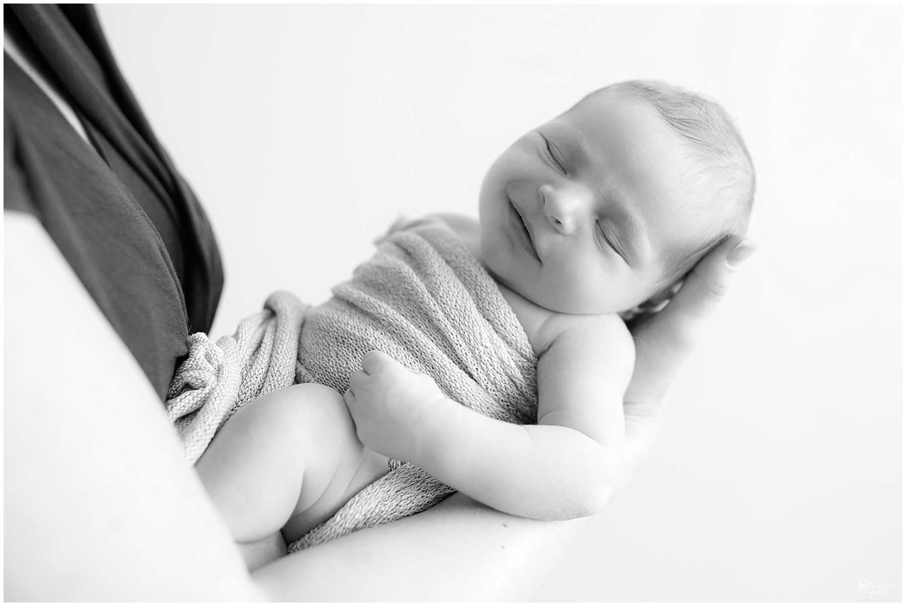 Mothers hands holding newborn baby son by Raindancer Studios Indianapolis Newborn Photographer Jill Howell