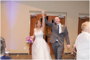 Bride and groom entering after the ceremony by Raindancer Studios Indianapolis Wedding Photographer Jill Howell