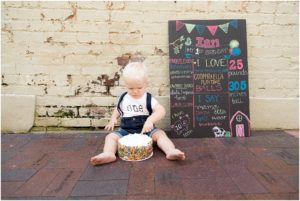 Little boy celebrating being one years old with smash cake, Columbus Family Photography, Raindancer Studios