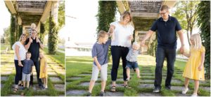 Parents and their three children holding hands walking, Columbus Family Photographer, Raindancer Studios