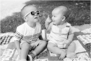 Baby sister intrigued by big brothers sunglasses. Indianapolis Family Photography, Raindancer Studios