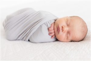 Newborn baby boy swaddled in gray blanket, Indianapolis Newborn Photography, Raindancer Studios