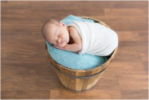Newborn baby boy swaddled inside bucket, Indianapolis Newborn Photography, Raindajncer Studios