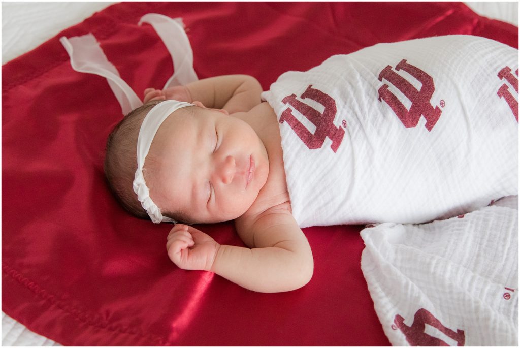 Baby swaddled in Indiana University blanket. Indianapolis Baby Photography