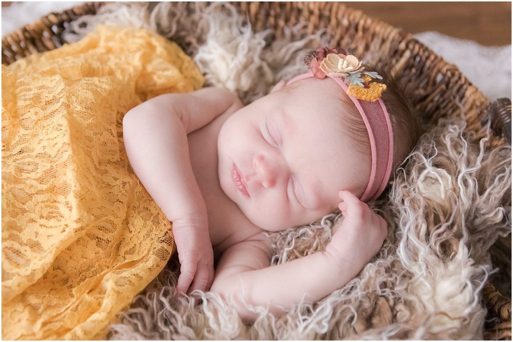Newborn girl swaddled in yellow blanket. Indianapolis Newborn Photography